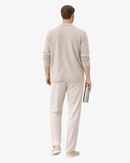 Man in beige casual outfit holding a bottle, Arlori fashion, white background